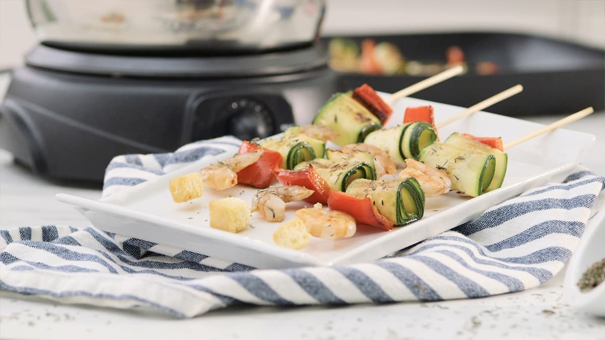 Brochetas de langostinos con fondue