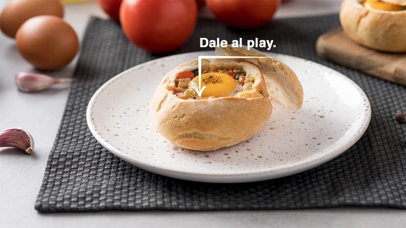 Huevos al nido con pisto